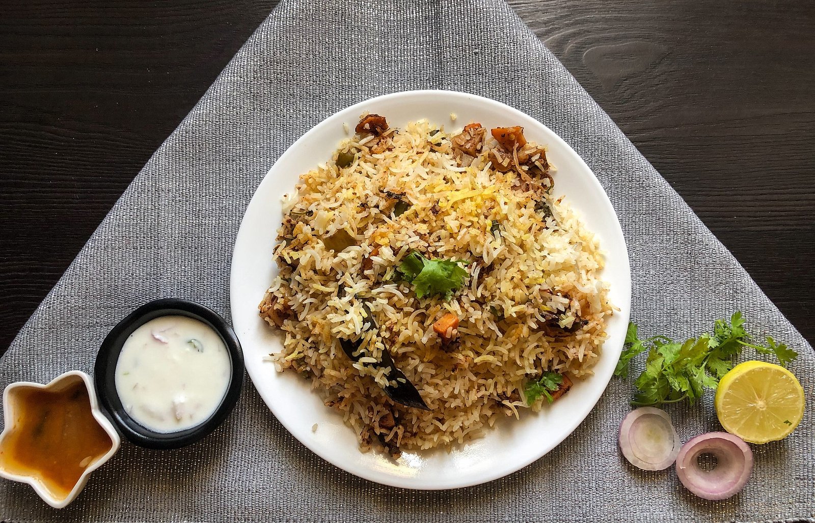 This dish is Biryani, specifically identified as Hyderabadi Dum Biryani.