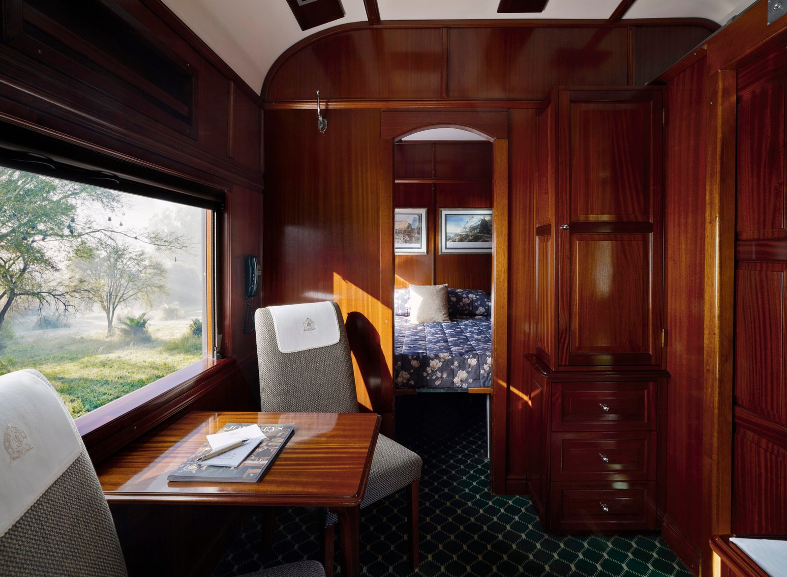 Rovos Rail Deluxe Suite with lounge area and bedroom views