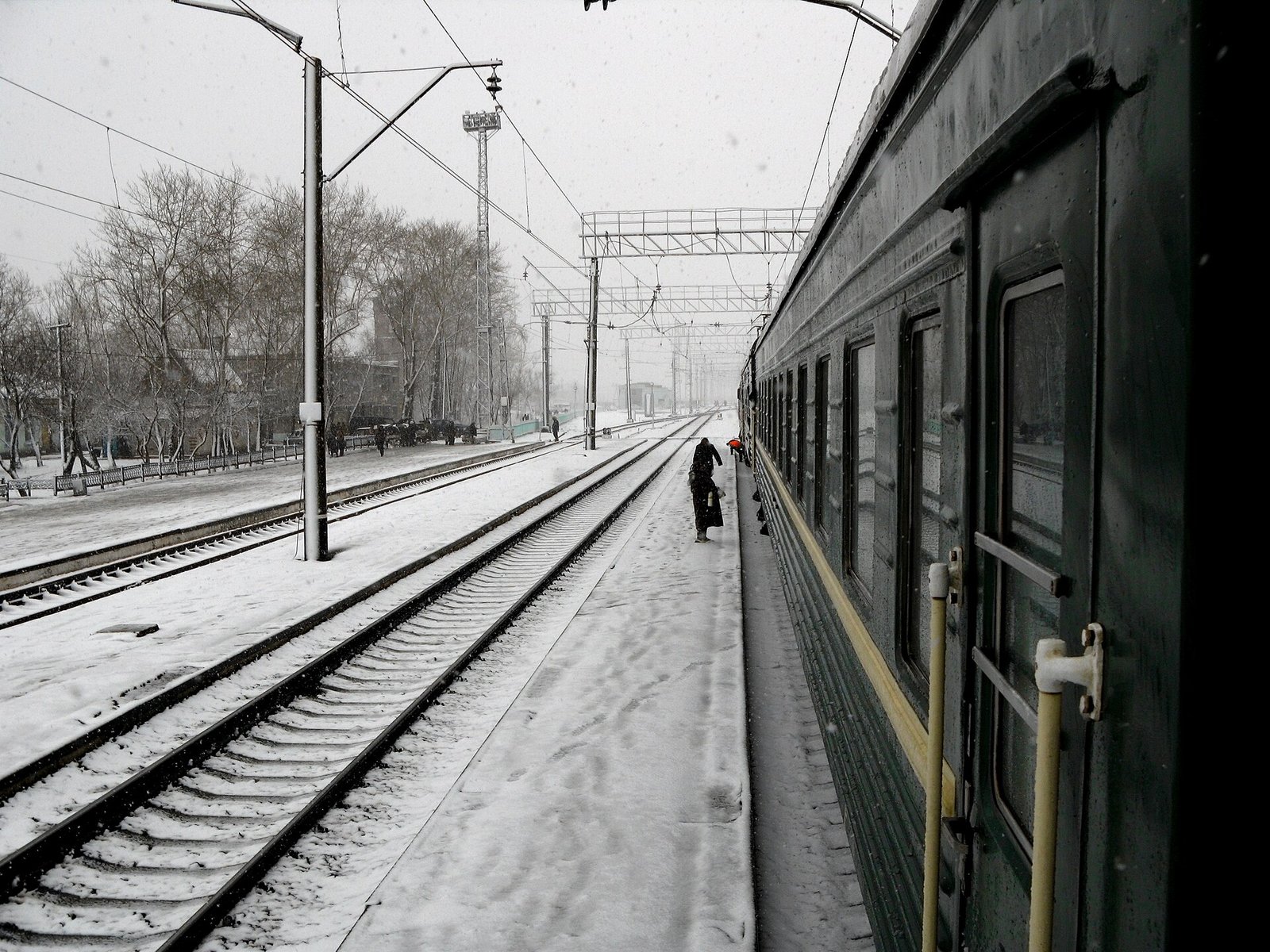 A Siberian station under late-April snow, hundreds of kilometres from the nearest city.