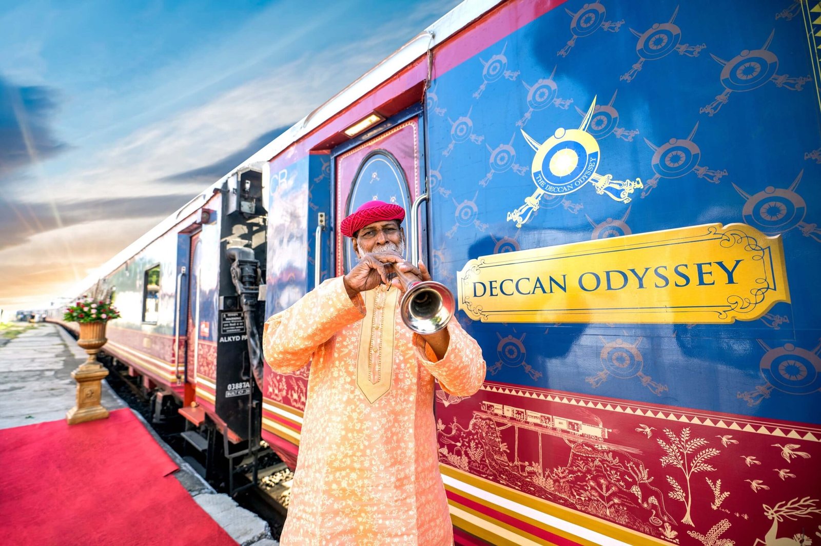 Ceremonial welcome beside the Deccan Odyssey luxury train, offering the best train travel in India