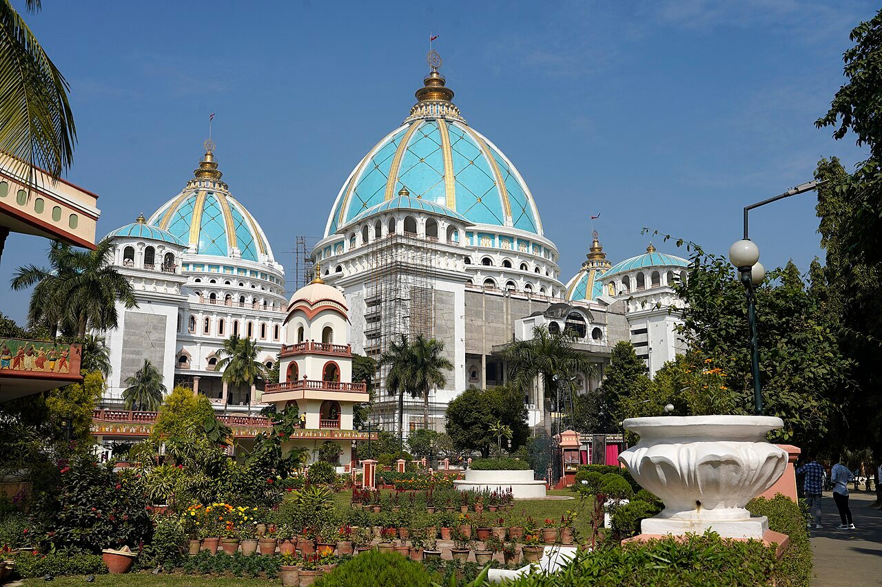 Blue and white domes of the ISKCON temple at Mayapur surrounded by gardens